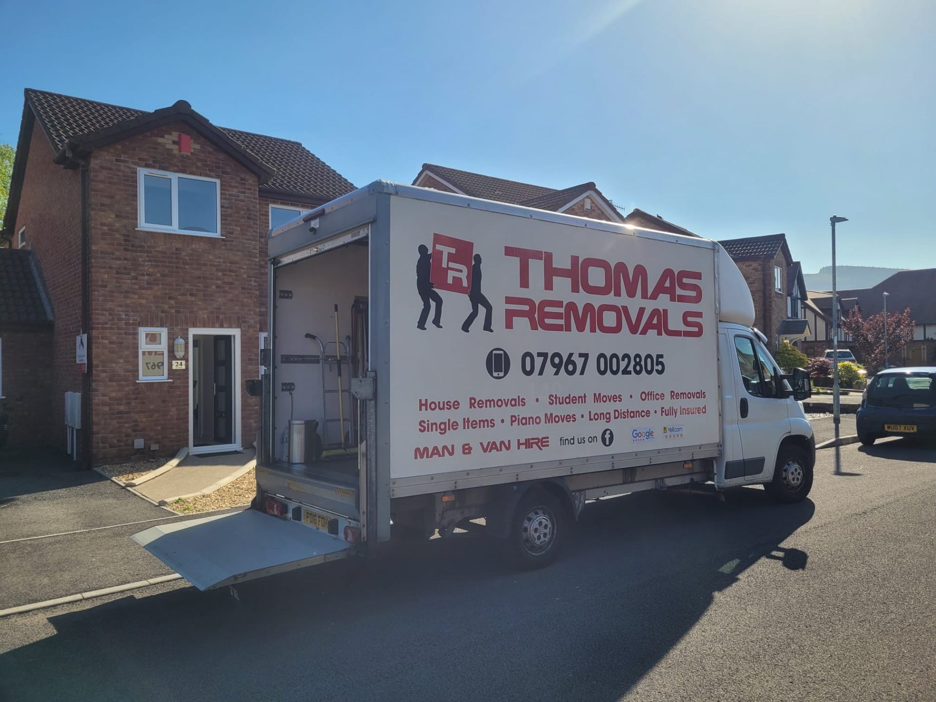 Thomas Removals van with ramp down ready for loading furniture during a house removal