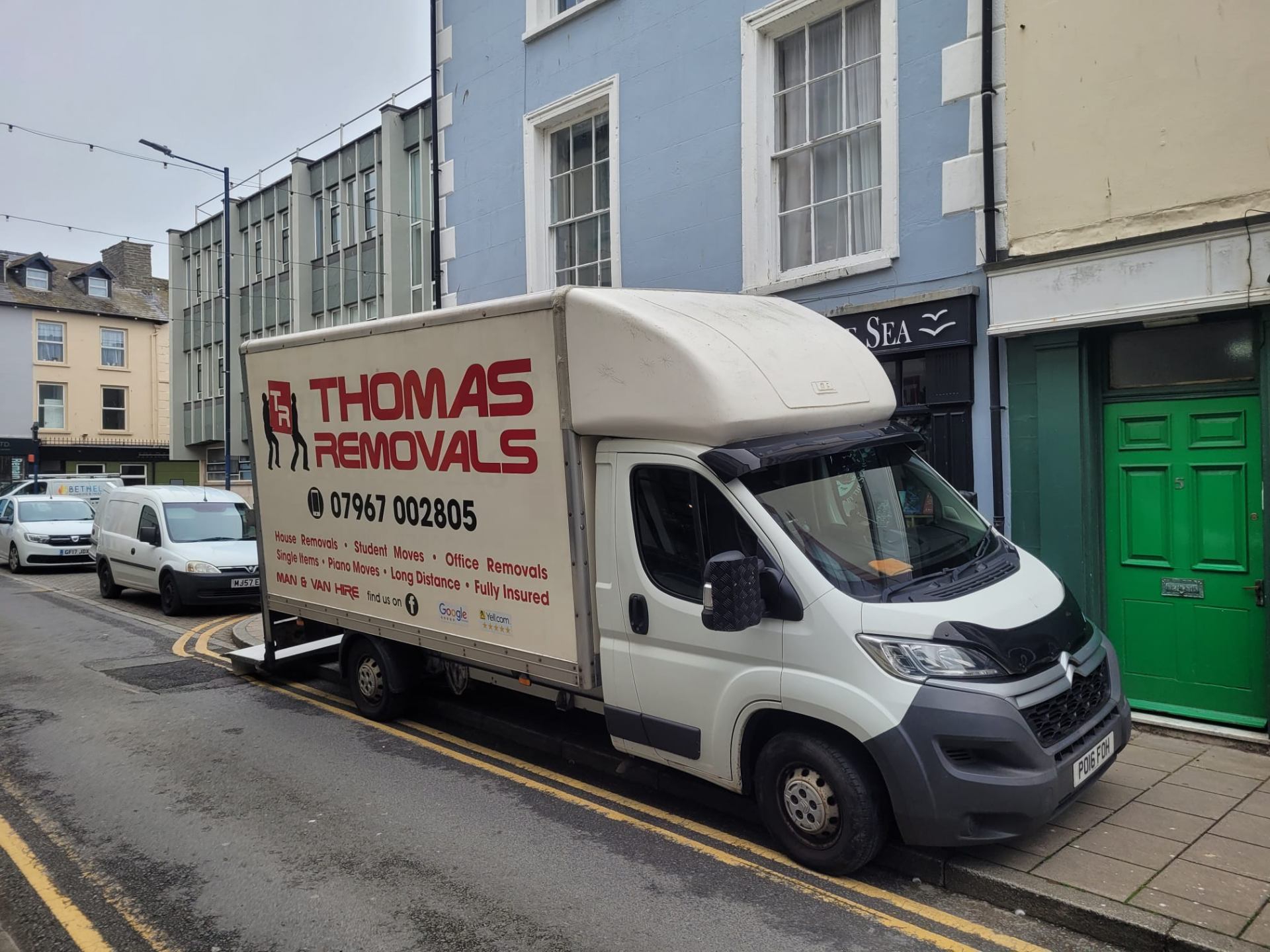 Thomas Removals van in a Welsh town centre during a local removal