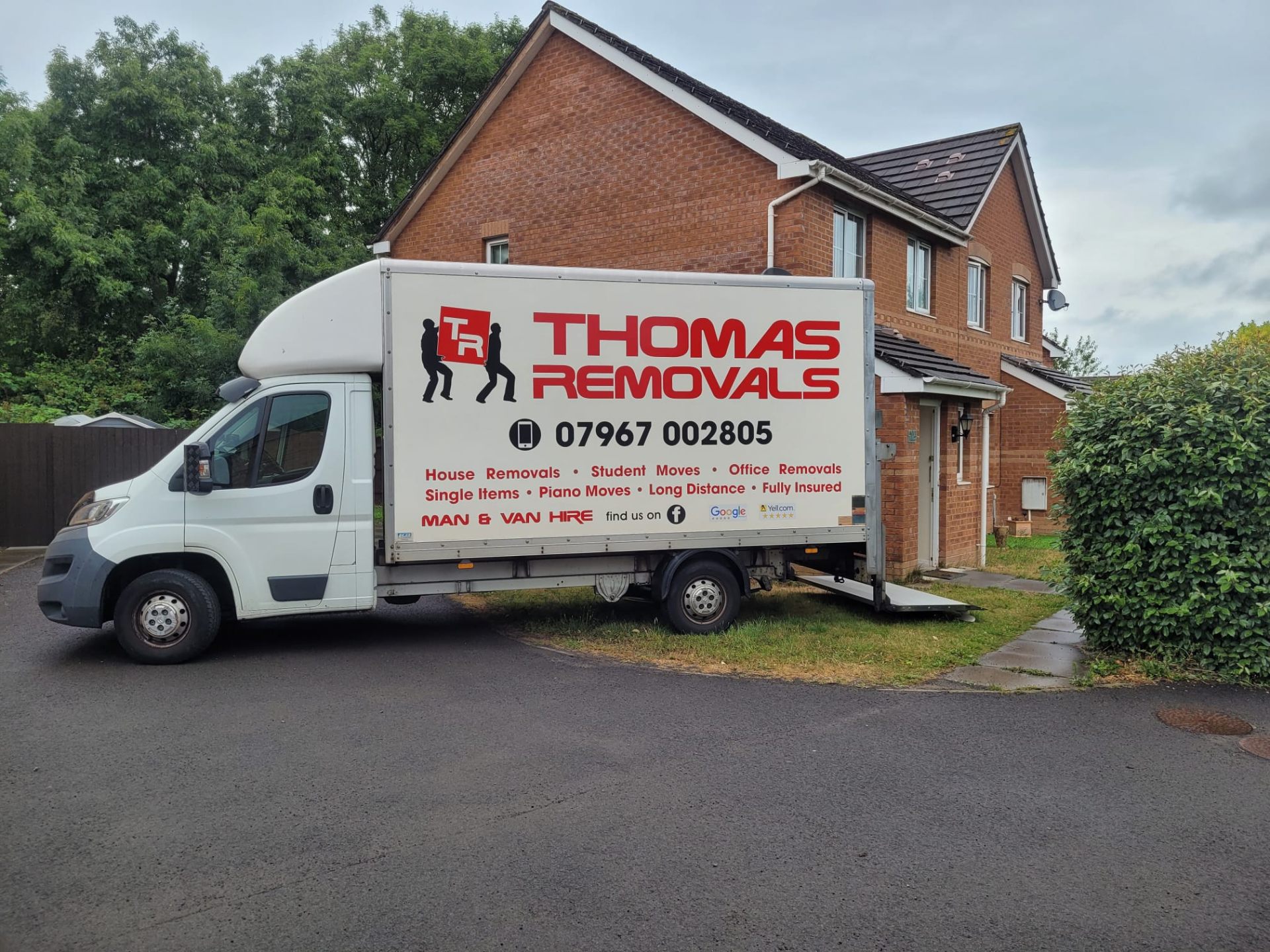Thomas Removals van outside a detached house during a full home removal
