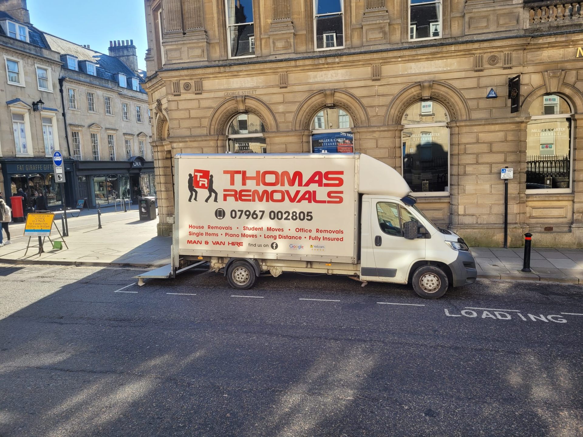 Thomas Removals van in Bath city centre during a long-distance removal